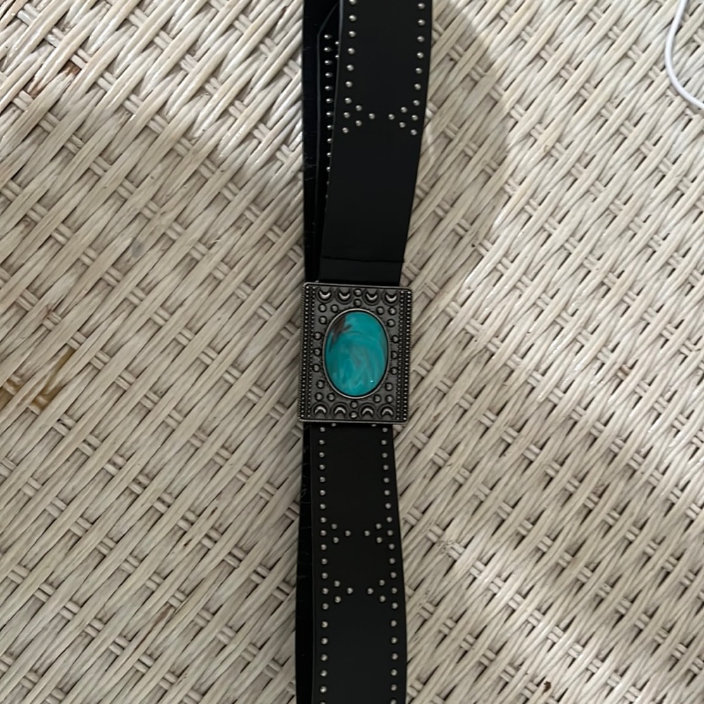 Black belt with little silver studs in a turquoise buckle
